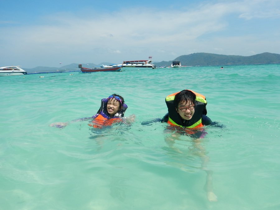 Me as a kid swimming in the ocean in Thailand